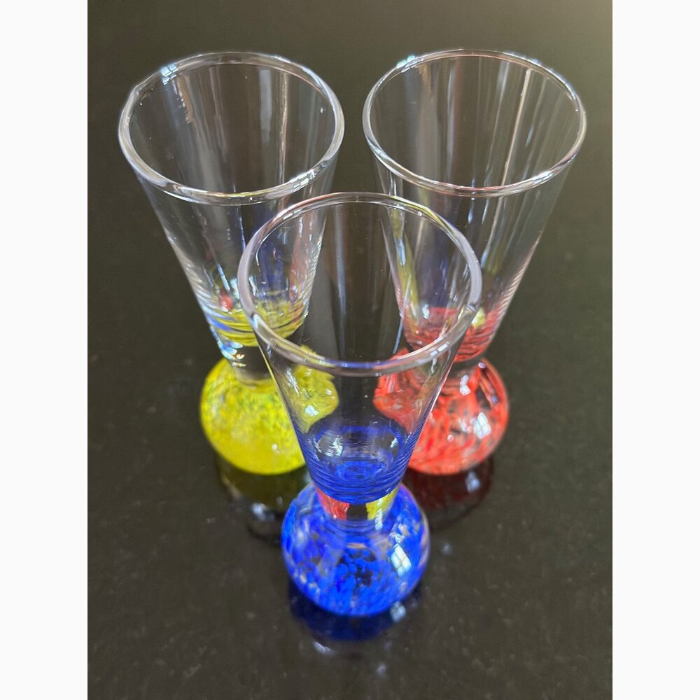 3 Shot Glasses. Red, Yellow and Blue Bases